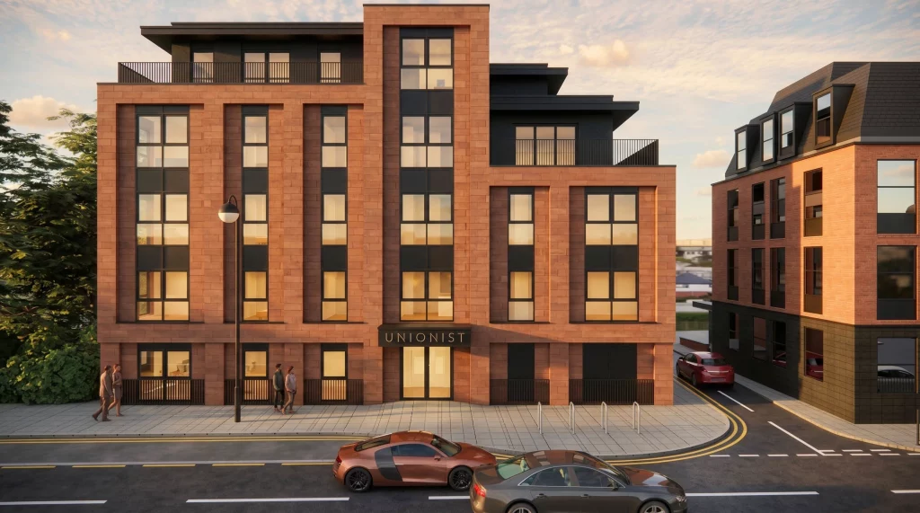 Modern brick apartment building with tall windows, balconies and a sign reading UNIONIST, street and parked cars in front
